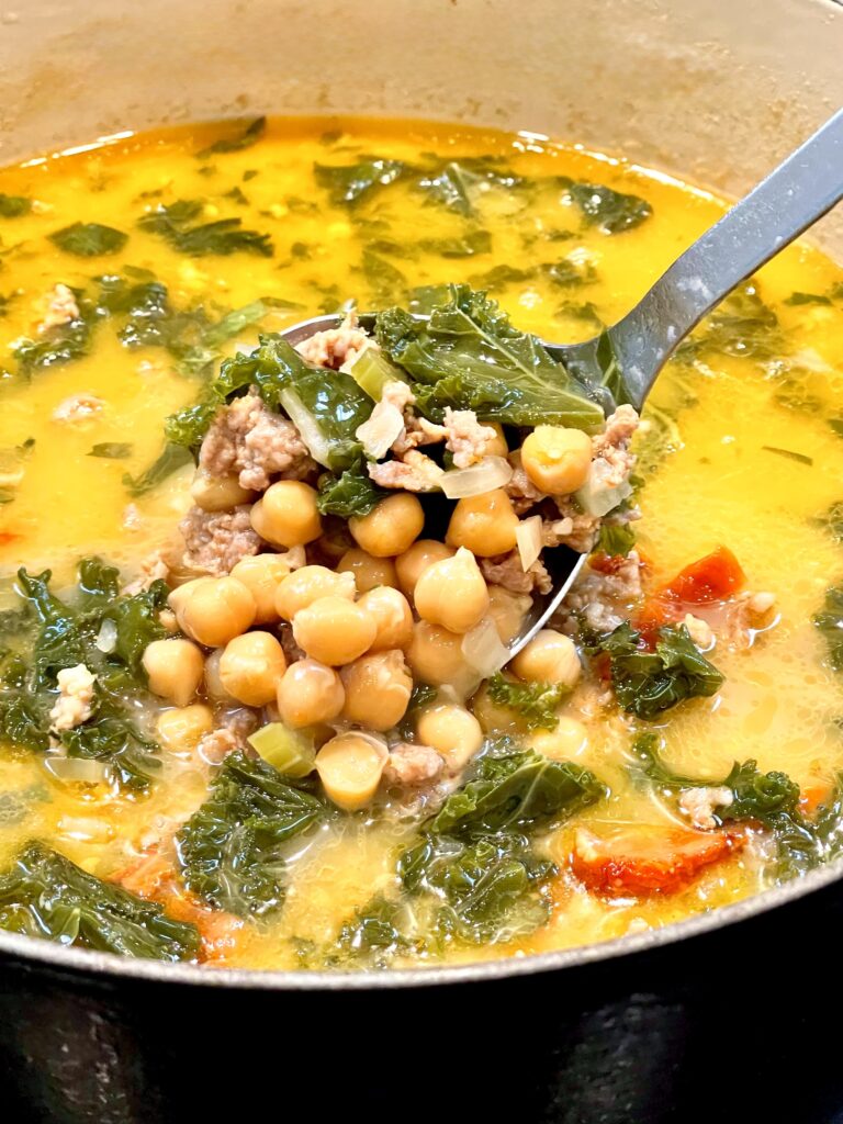 Photo of Creamy Tuscan Soup in a black Dutch Oven